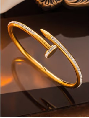 Gold plated stanless steel nail-inspired bangle bracelet with CZ stones