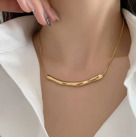 Gold Plated Stainless Steel Tranish-Free Arc Chain Necklace With Irregular Bar Pendant.